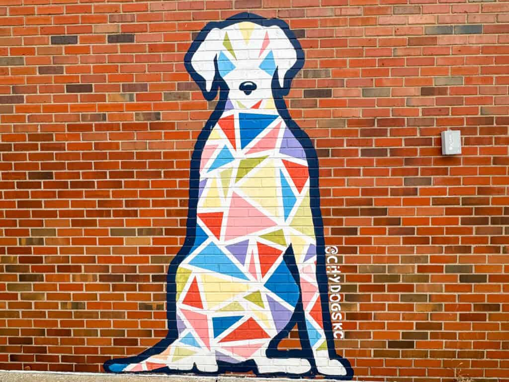 city dogs mural of a dog on a brick wall