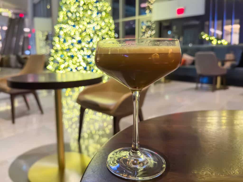 peppermint martini in front of a christmas tree