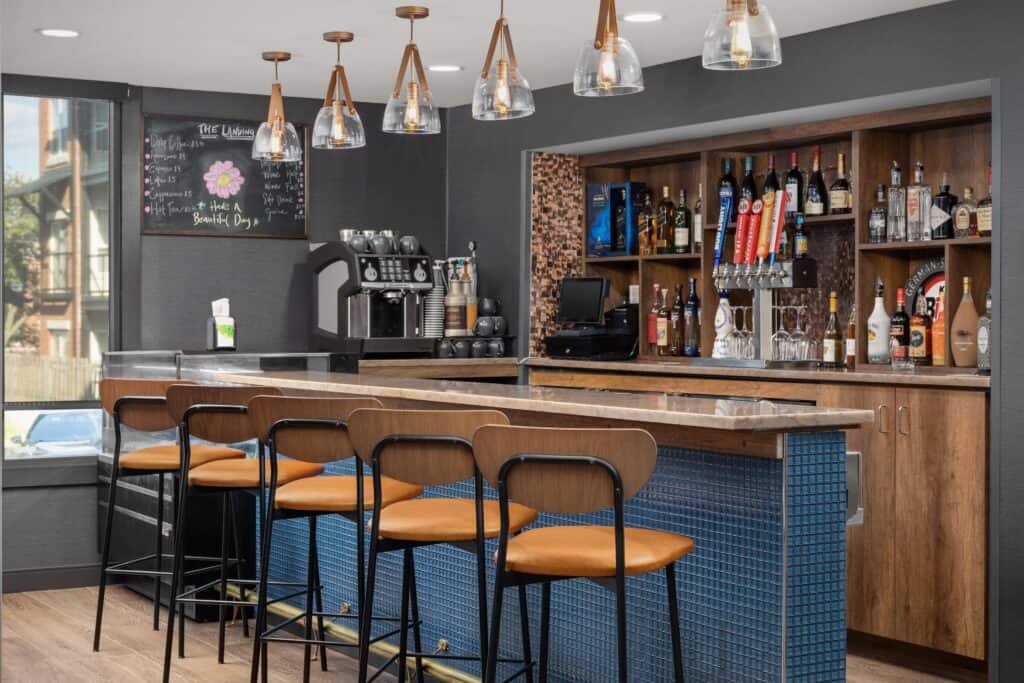 hotel westport bar with tan leather stools and light fixtures