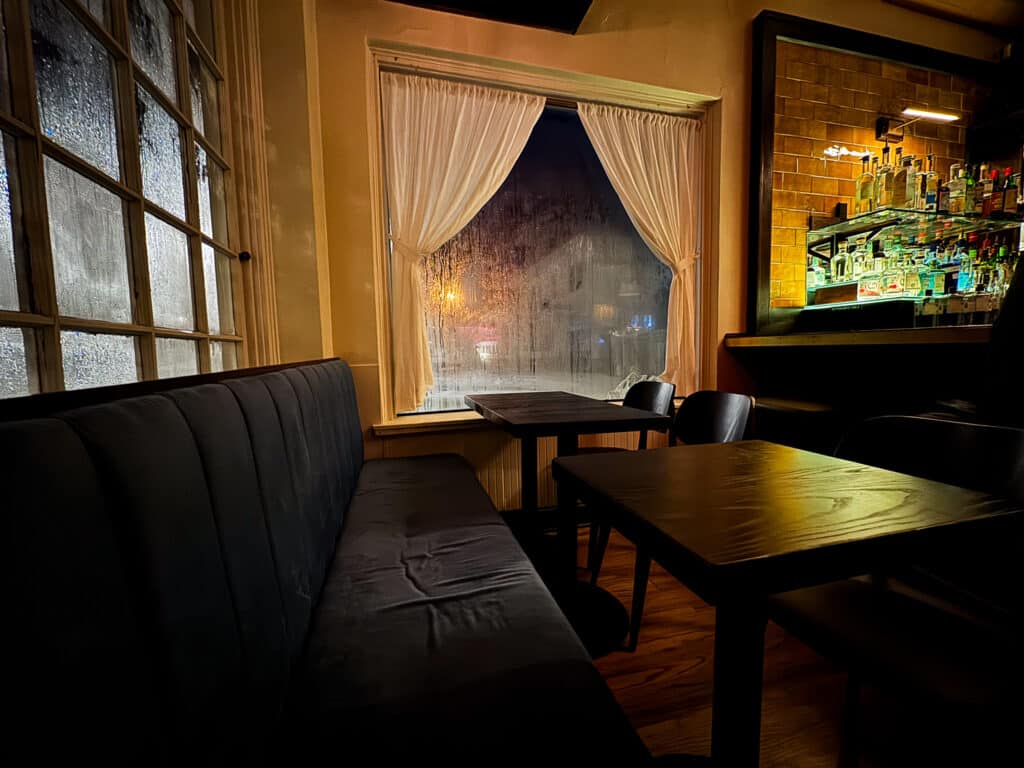 new wine bar in kansas city with upholstered seats and cozy vibe